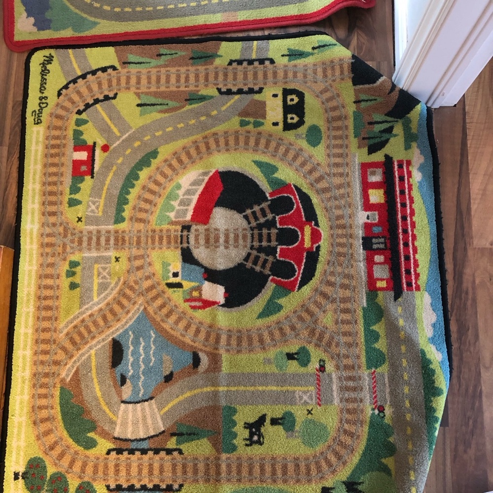 Two Melissa & Doug play mats